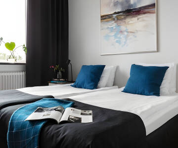 Hotellets lyse og komfortable værelser indbyder til afslapning og hygge