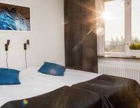 Hotellets lyse og komfortable rom innbyr til avslapping og kos
