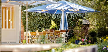 Relax with a drink in the conservatory or the cosy beer garden.
