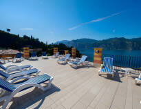 The hotel's large panoramic terrace is an ideal place to enjoy holiday life and a glorious view of Lake Garda