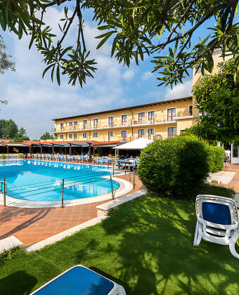 Relax by the pool and enjoy life under one of the parasols on the hotel's beautiful sun terrace