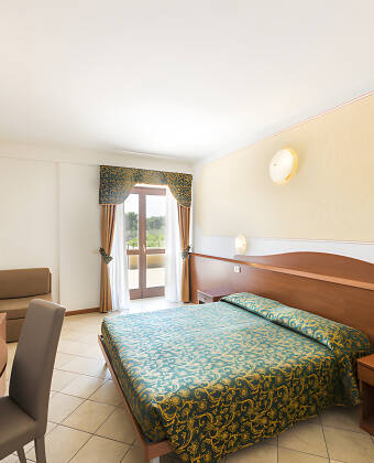 The hotel's rooms offer a comfortable base and charming setting for your stay.
