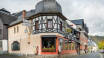 The historic Hotel Ellenzer Goldbäumchen is centrally located in the town and directly by the Moselle River.