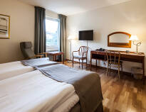 The cosy and modern rooms are furnished with beautiful wooden floors and comfortable beds.