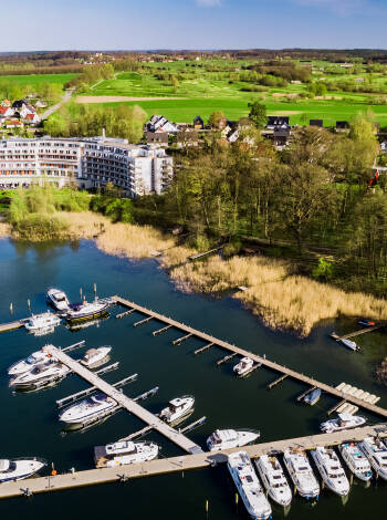 In the heart of the beautiful Mecklenburg Lake District, Seehotel Fleesensee has its own bathing island and offers free parasols and loungers.