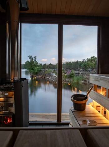 Experience a traditional wood-fired sauna with views across the Dalälven River.