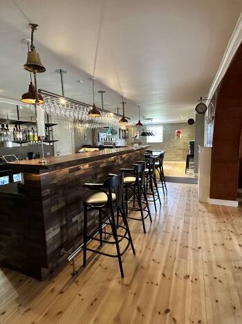 The bar/lounge offers the perfect setting for unwinding with a drink in a warm, inviting atmosphere.