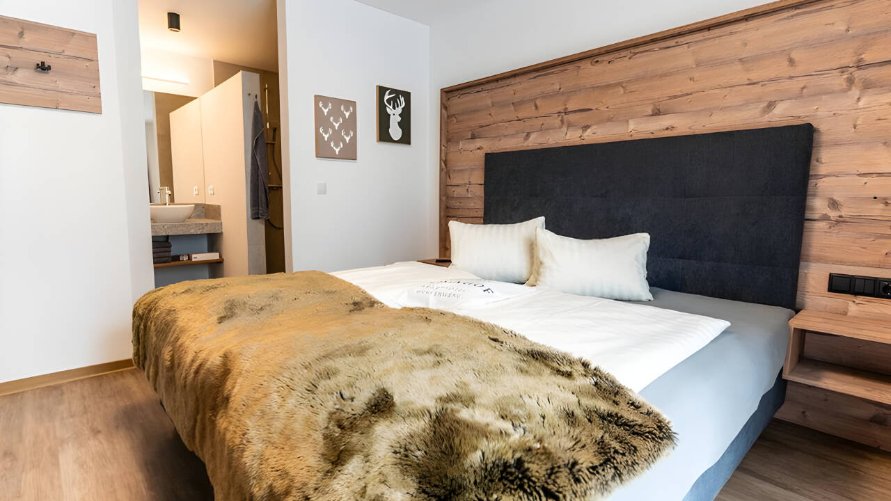 Stay in cozy rooms with natural wood and modern design.