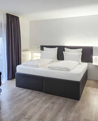 Relax in modern designer rooms with a complimentary minibar on arrival.