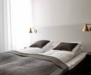 Die schöne Zimmer sind im modernen nordischen Stil und bieten Ihnen einen hohen Komfort!
