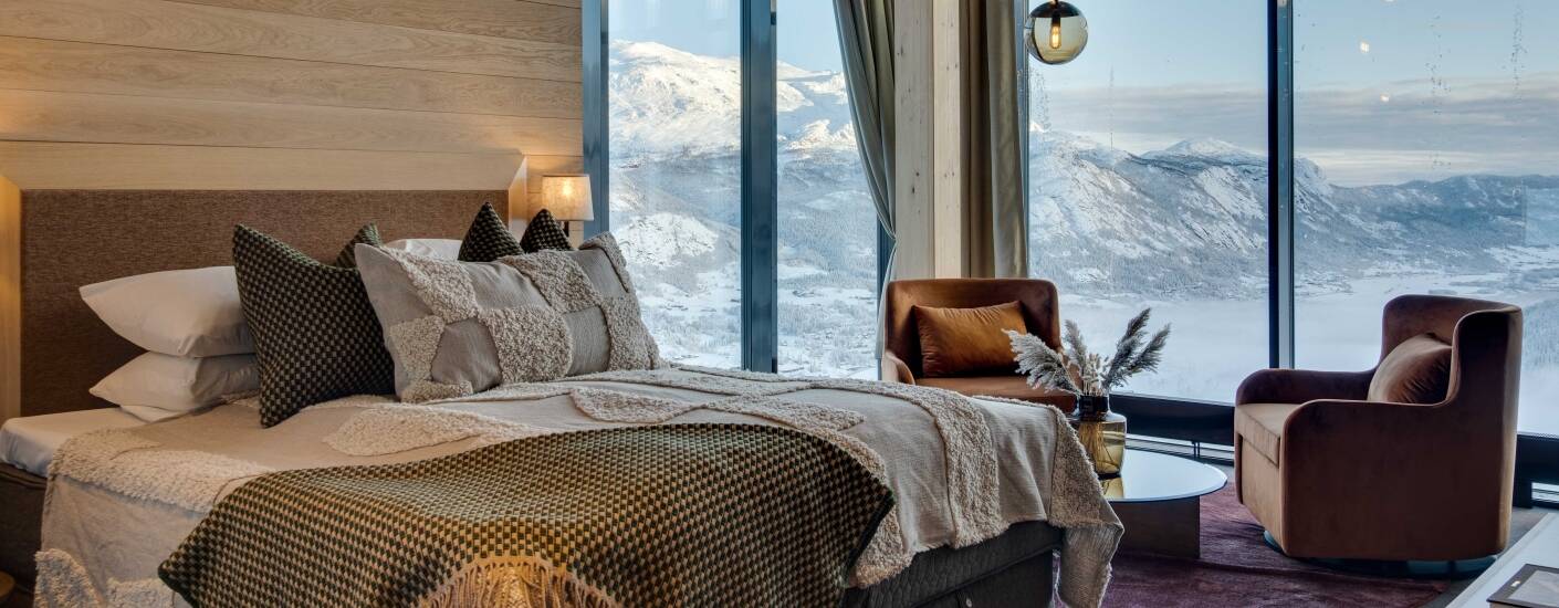 The rooms are bright, modern, and well-equipped, many with large windows and incredible views—perfect for unwinding after a day outdoors.