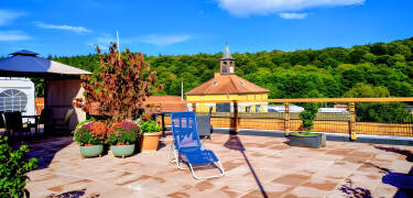 Relax on the rooftop terrace and take in the views across the peaceful surroundings.