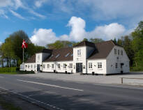 Discover Signesminde Kro, evolving from a farm to a charming family-run inn since 1830.