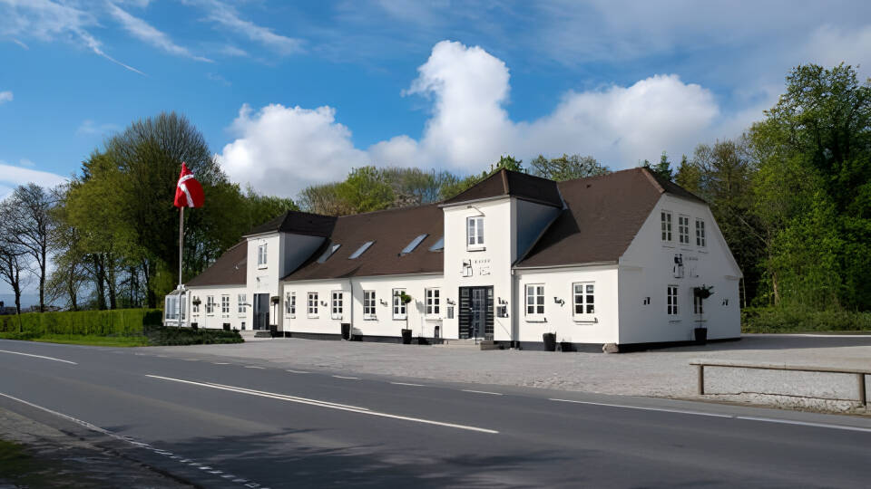 Discover Signesminde Kro, evolving from a farm to a charming family-run inn since 1830.