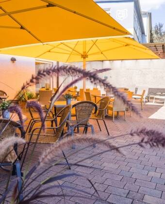 On a nice day, plan your adventures with a drink in hand on the hotel’s courtyard.
