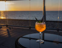 End the day with a delicious drink on the rooftop terrace facing the Baltic Sea.