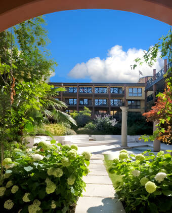 The hotel complex has a lush courtyard and rooms both with and without balcony