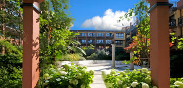 The hotel complex has a lush courtyard and rooms both with and without balcony