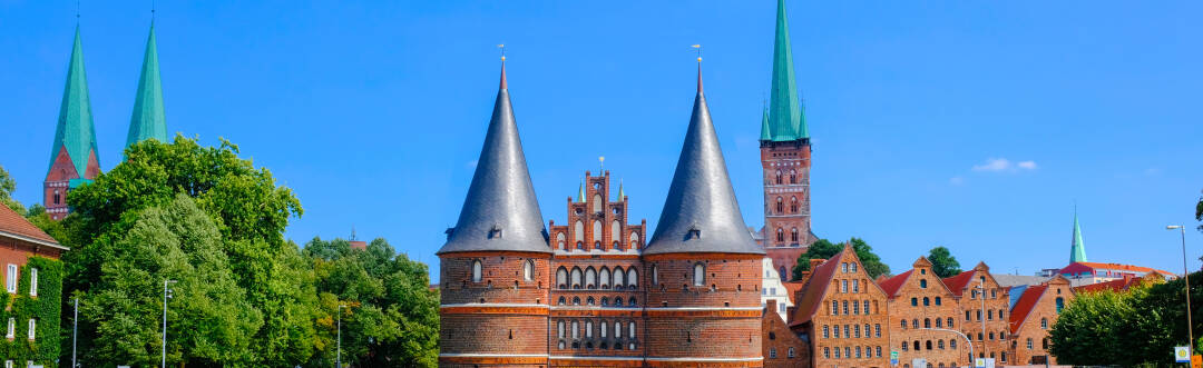 Try some marzipan and explore the historic charm of Lübeck, just a short 30-minute trip away.