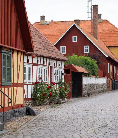 Stroll through Åhus old town, filled with historic buildings, cafés, and shops.