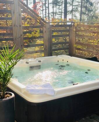Unwind in the outdoor Jacuzzi —it's the perfect way to relax!