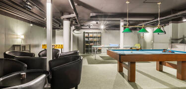Play some games in the game room, like billiards, table tennis, and table football.