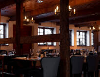 Hotellets restaurang, Thott's, är inredd i Malmös äldsta korsvirkeshus, från 1558.