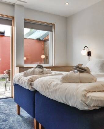 Nyt rom i nordisk lys stil med unike historiske detaljer som speiler lokal arv.