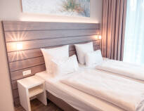 The modern and stylish rooms provide a comfortable setting for your stay in Munich.
