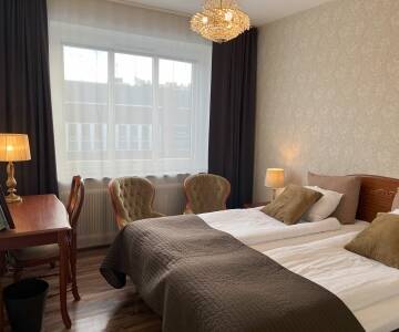 Slapp av på hotellets koselige rom og få ny energi på din miniferie.