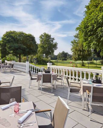 This elegant Dorint hotel in Bavaria is directly on a golf course and has a terrace with views of the course.