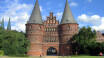 Visit Holstentor and enter the city through the old city gate. You can choose to walk around on your own or pay for a guided tour.