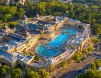 Take a dip in the Szechenyi Baths and relax in the warm water.