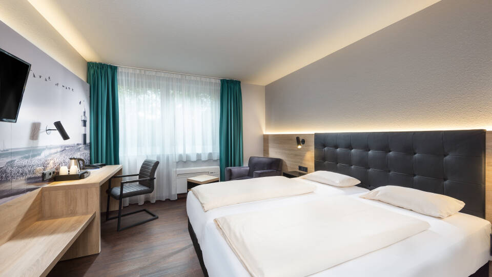 Hotellets moderna rum hjälper dig att koppla är  en en härlig bas för er semester.