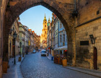 Explore Mala Strana and enjoy a break in a café with a cup of coffee.