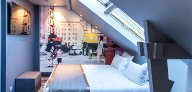 The cosy rooms feature art on the walls.