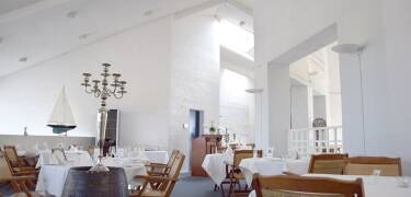 Dine and enjoy a glass of wine with your meal in the hotel's bright restaurant.