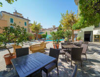 Sit on the hotel terrace and enjoy the sun and warmth.
