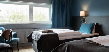 Nyd opholdet på et af hotellets moderne og komfortable dobbeltværelser.