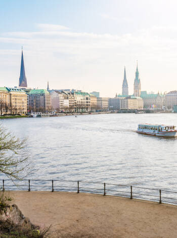 Stroll to Jungfernstieg and take in the iconic Alster panorama.