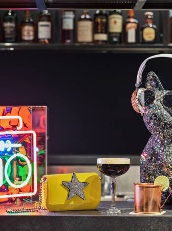 Gather at the Moxy Bar for drinks, snacks, games, and a vibrant social vibe.