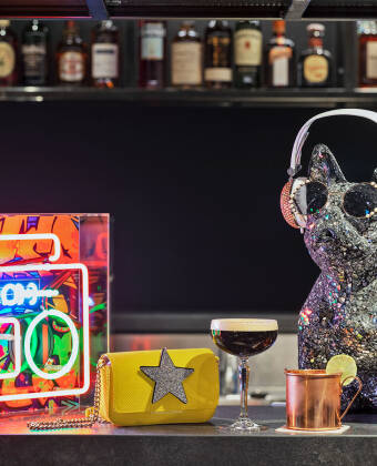 Gather at the Moxy Bar for drinks, snacks, games, and a vibrant social vibe.