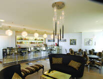 Enjoy a drink or espresso in the airy indoor bar
