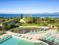 The complex has several outdoor swimming pools with sun loungers and parasols