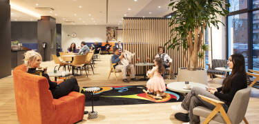 The lobby offers a friendly atmosphere with a bar for drinks and socializing.