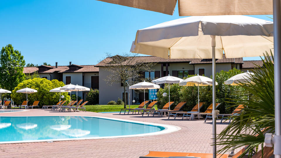 Soak up the sun and swim in the hotel's outdoor pool during the summer months.