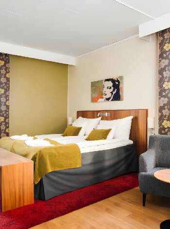 The hotel's cosy rooms are decorated in bright colours and full of charm.
