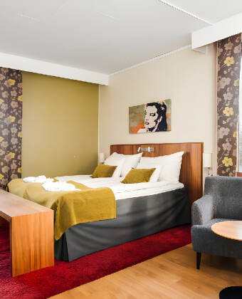 Die gemütlichen Zimmer des Hotels sind in hellen Farben und mit viel Charme eingerichtet.